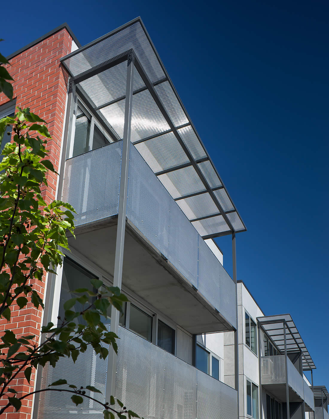 40 Brisbane Street, Hobart, Tasmania: Robust, low maintenance materials and minimal finishes to the building envelop and clip-on balcony and sun-shade elements present a lively aesthetic that fits the urban context. Photo by Ray Joyce.