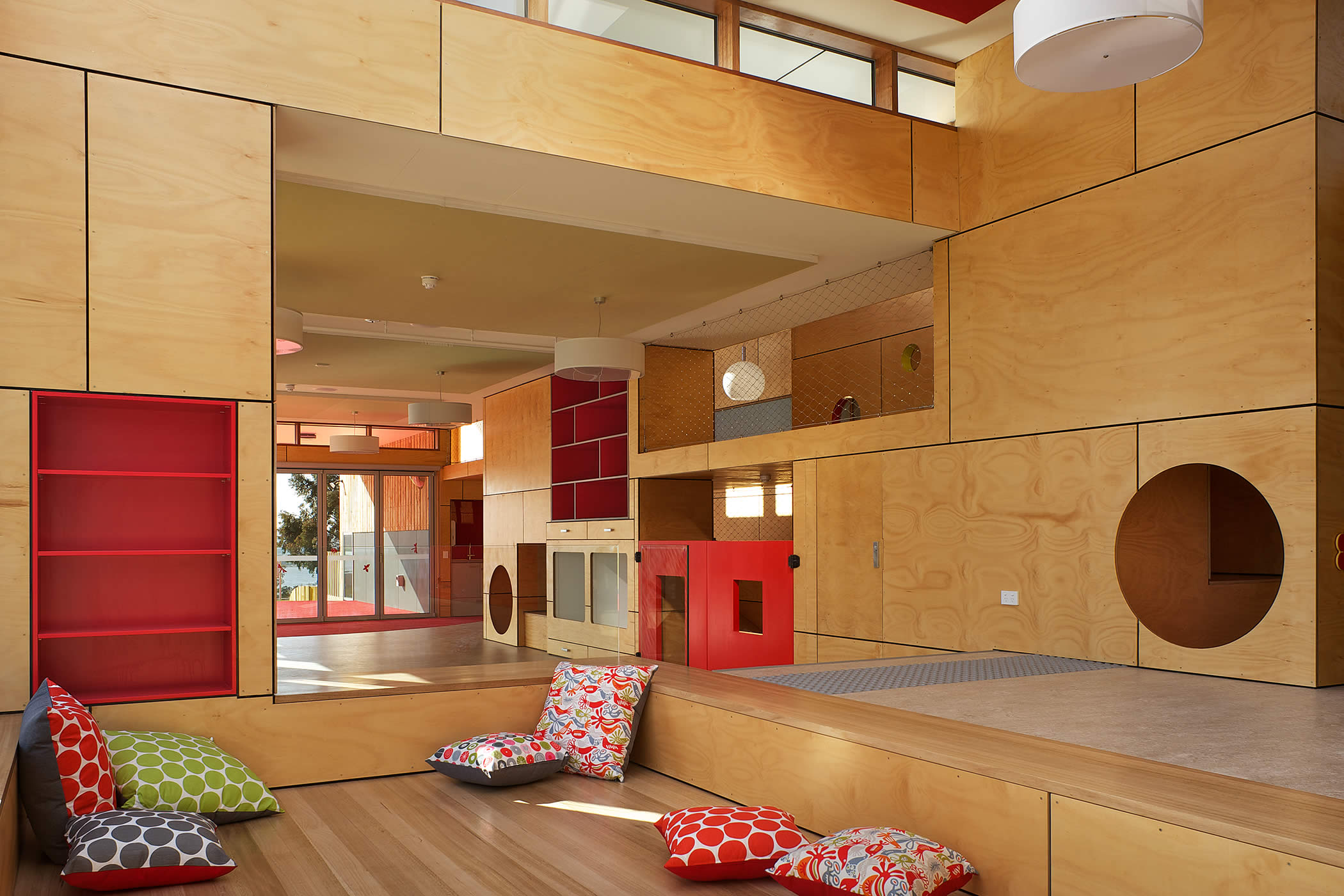 Chigwell Child and Family Centre, Tasmania: The hoop pine natural timber paneled interior has visually connected interlinking volumes with a lively play of scale and a varied spatial experience.  Photo by Ray Joyce.