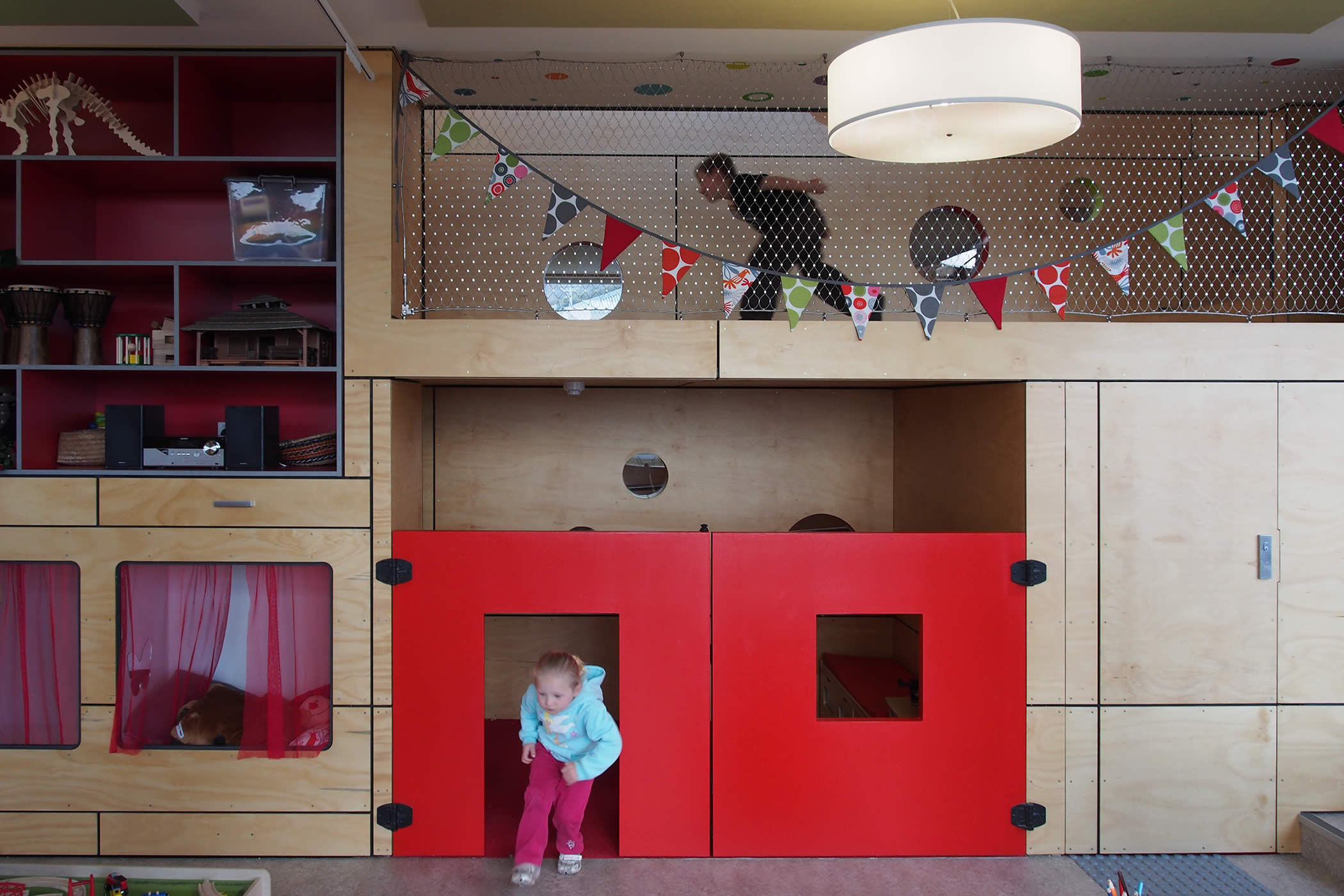 Chigwell Child and Family Centre, Tasmania: Stairs, slides and tunnels link varied play space and alcoves to the mezzanine play spine ensuring gross motor learning, spatial adventure and user engagement. Photo by Yvette Breytenbach.