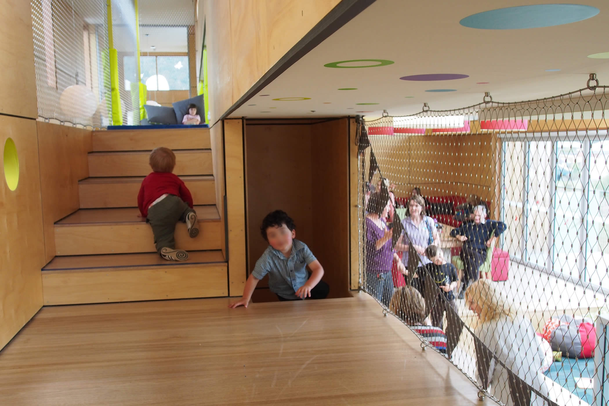 Chigwell Child and Family Centre, Tasmania: Visual connection between community space and the mezzanine play spine supports parent participation in learning programs fostering social inclusion and community cohesion.  Photo by Yvette Breytenbach.