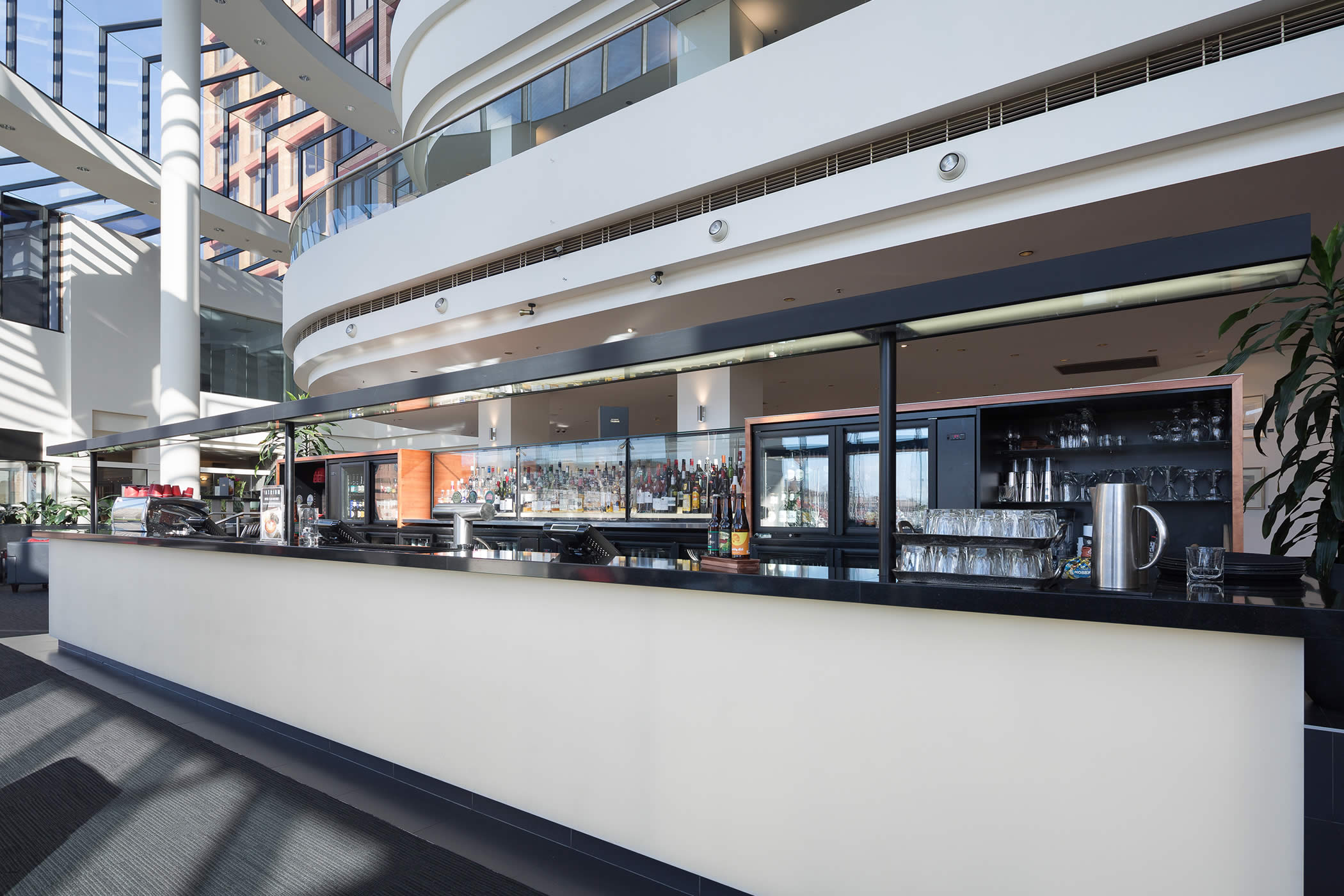 Hotel Grand Chancellor main foyer bar, Hobart: The restrained bar aesthetic creates, through contrast, an inviting place to linger within the otherwise busy foyer surrounds. Photo by Thomas Ryan.