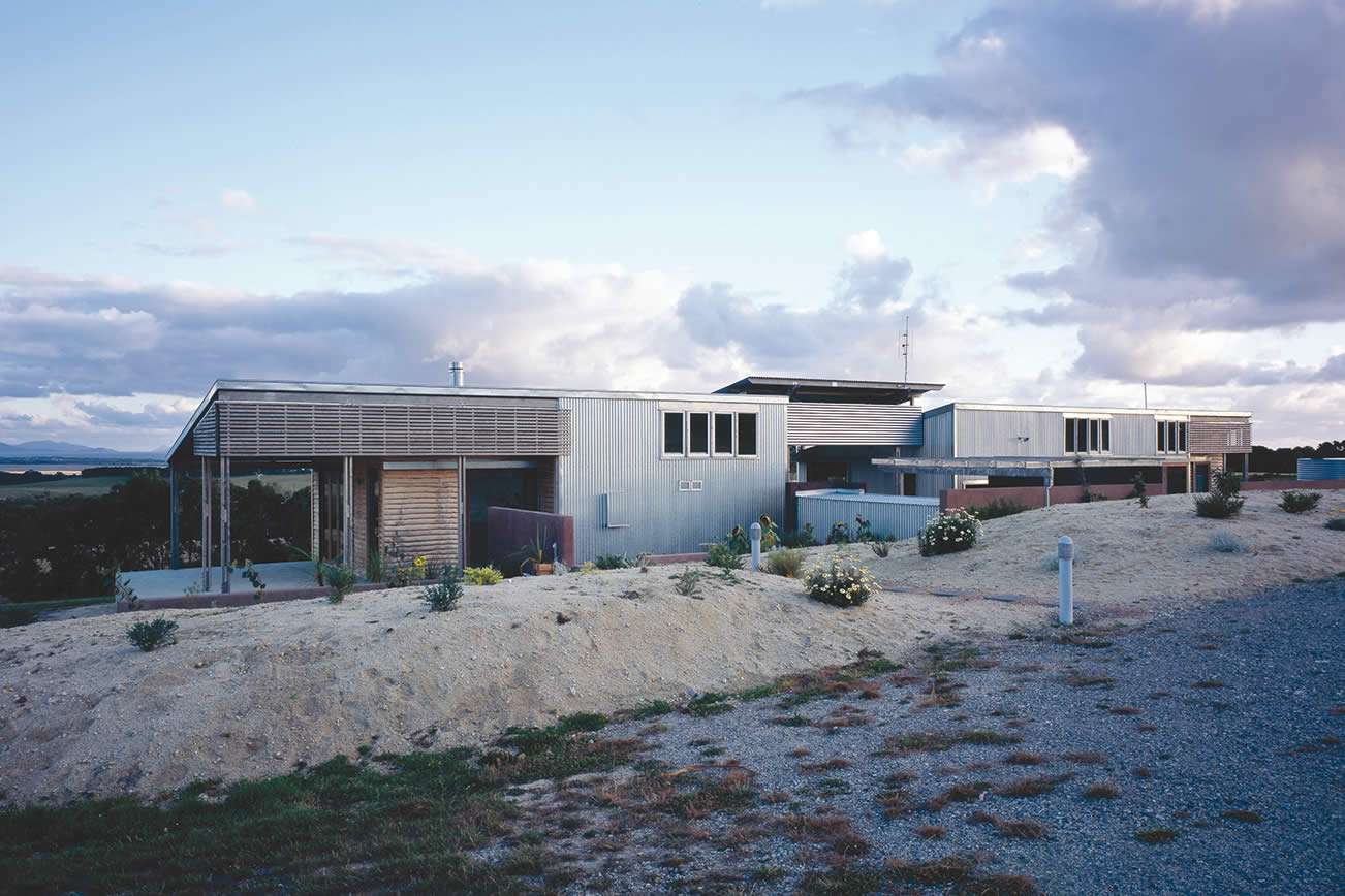 House Byrne, South Gippsland, Victoria: The low linear residence has sweeping views across pastoral farmland to the mountains of Wilson’s Promontory, the design responding to context and establishing a strong sense of place. Photo by Richard Gange.