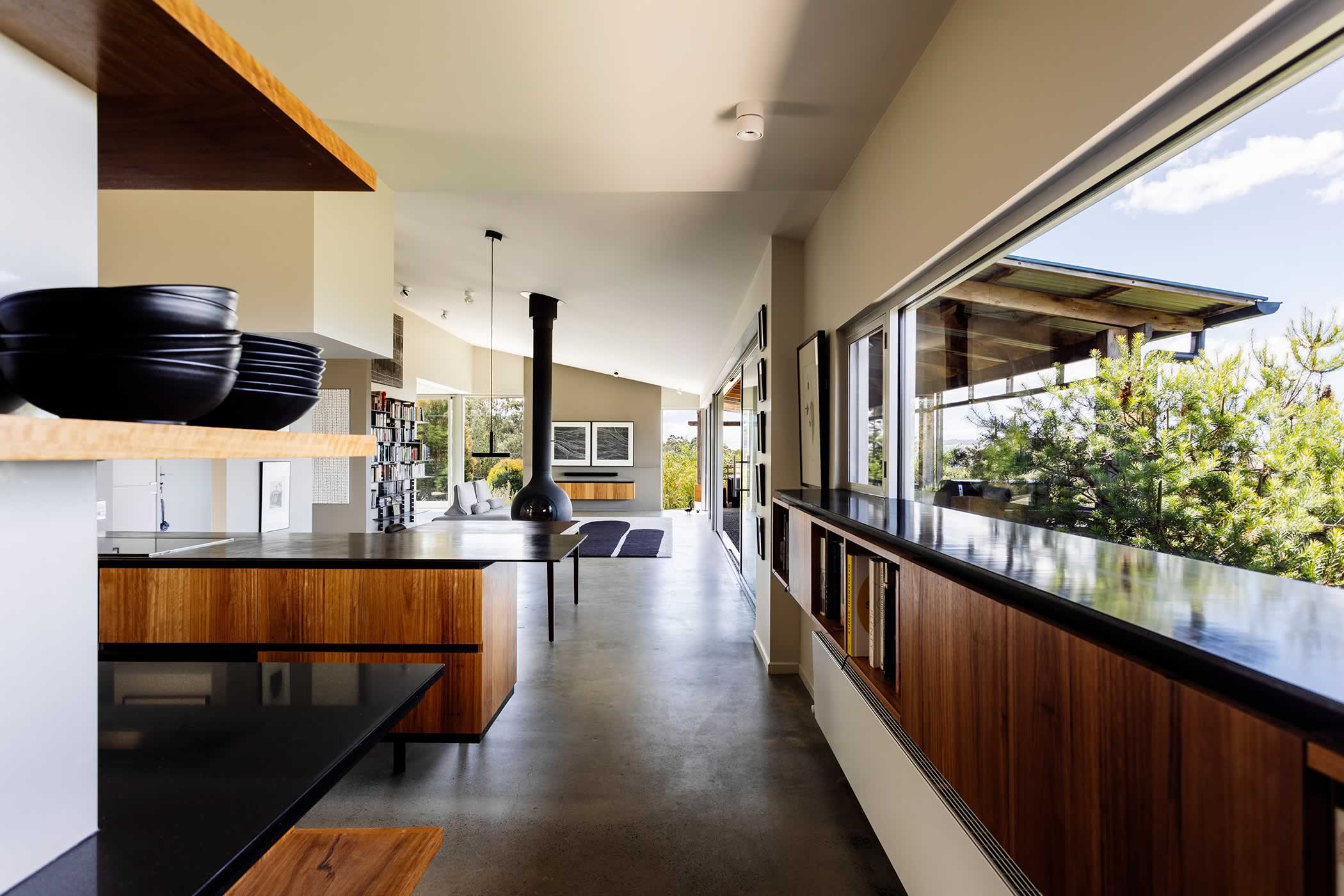 Residential extension, Kettering, Tasmania: The hidden butler’s pantry and reconfigured kitchen suits our clients’ love of cooking linking to the dining, living areas to enable easy interaction with their guests. Photo by Adam Gibson.