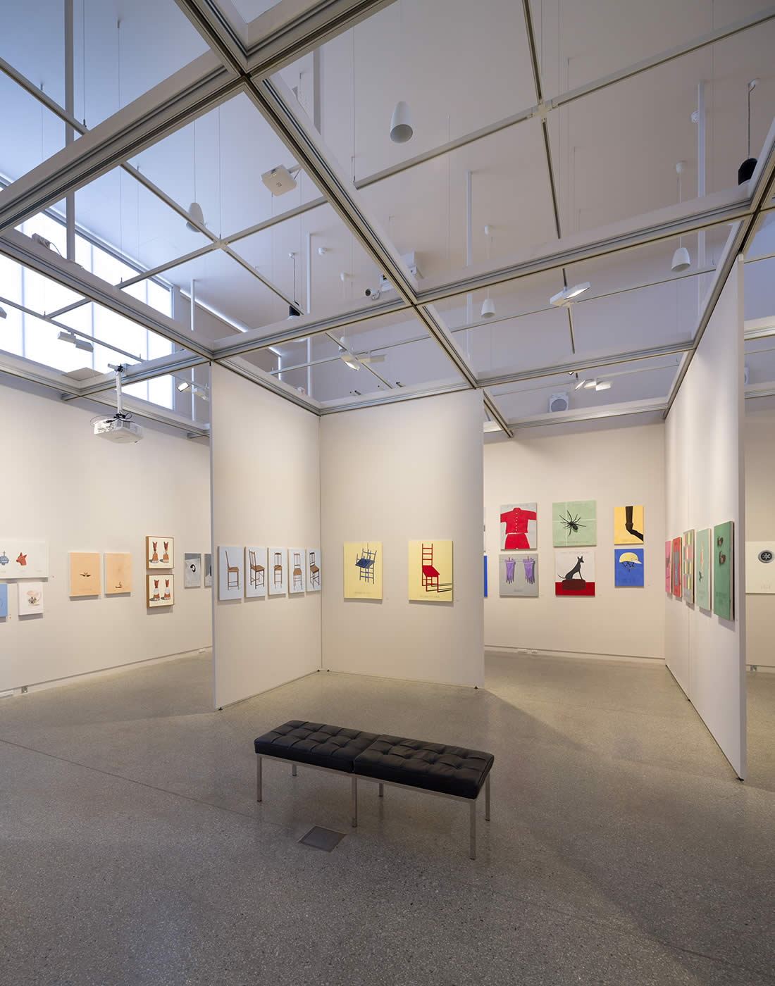 Translucent polycarbonate panels allow diffuse natural light into the visual arts exhibition space with its unique hanging system on a track grid for easy installation and flexible configuration of display panels. Photo by Thomas Ryan.