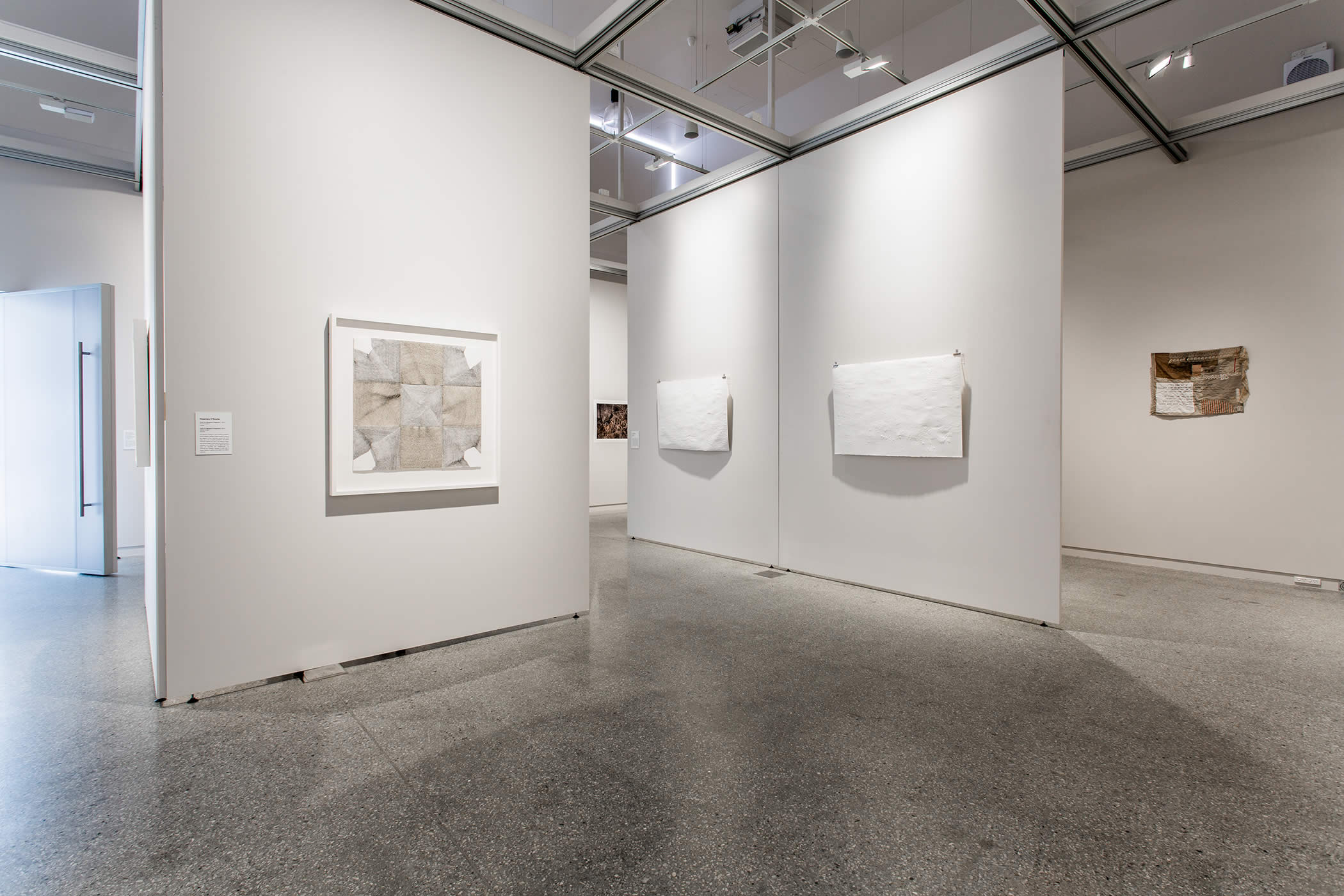 The unique hanging system on a track grid enables exhibitors at Moonah Arts Centre to configure the space in a multitude of ways by means of easy manipulation of display panels, thereby solving an intractable exhibition problem. Photo by Adam Gibson.