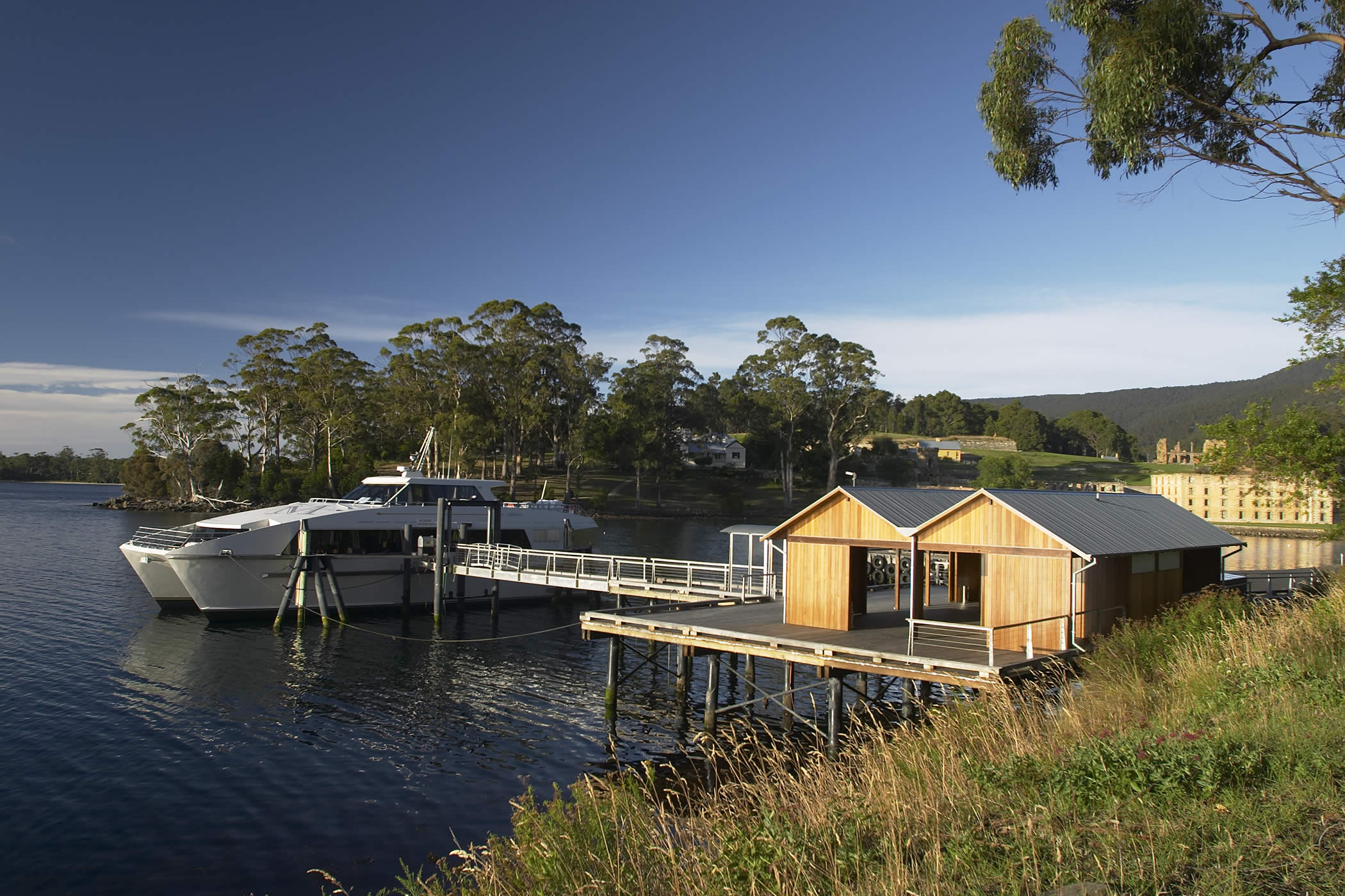 Port Arthur Jetty Shelter, Tasmania: Constructed of Tasmanian timbers, the shelter form evokes a traditional boatshed and provides a place for pause, enabling orientation and contemplation of the historic setting. Photo by Peter Whyte.