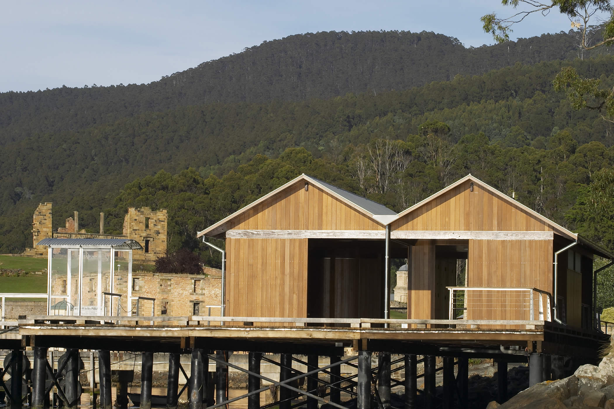 Port Arthur Jetty Shelter, Tasmania: The sympathetic contemporary insertion, constructed of Tasmanian timbers, is consistent with best practice conservation principles in a World heritage Australian Convict Site.  Photo by Peter Whyte.