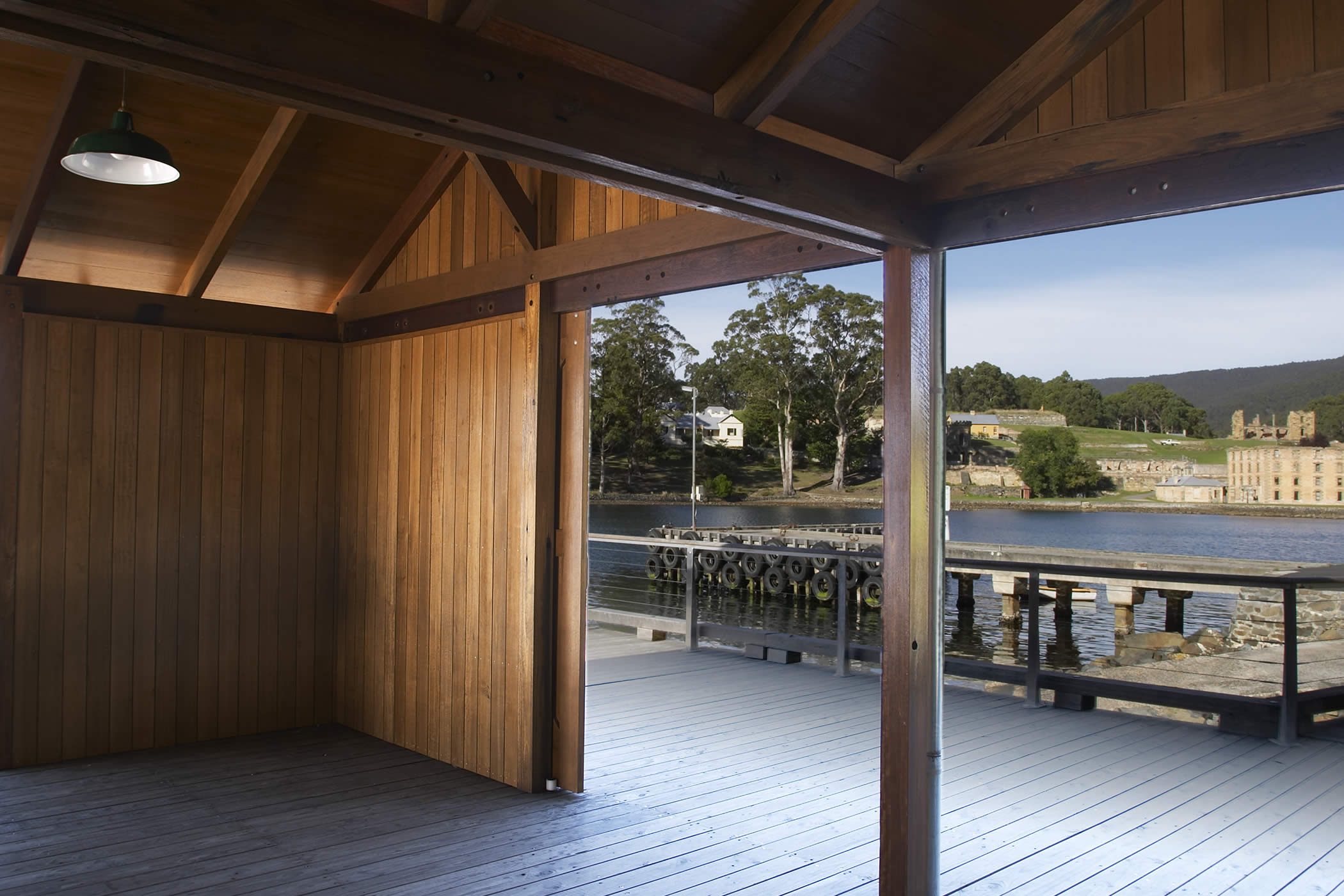 Port Arthur Jetty Shelter, Tasmania: Sliding Tasmanian timber screens enable their flexible configuration to open the amenity to its historic context or close it down responsive to weather conditions. Photo by Peter Whyte.