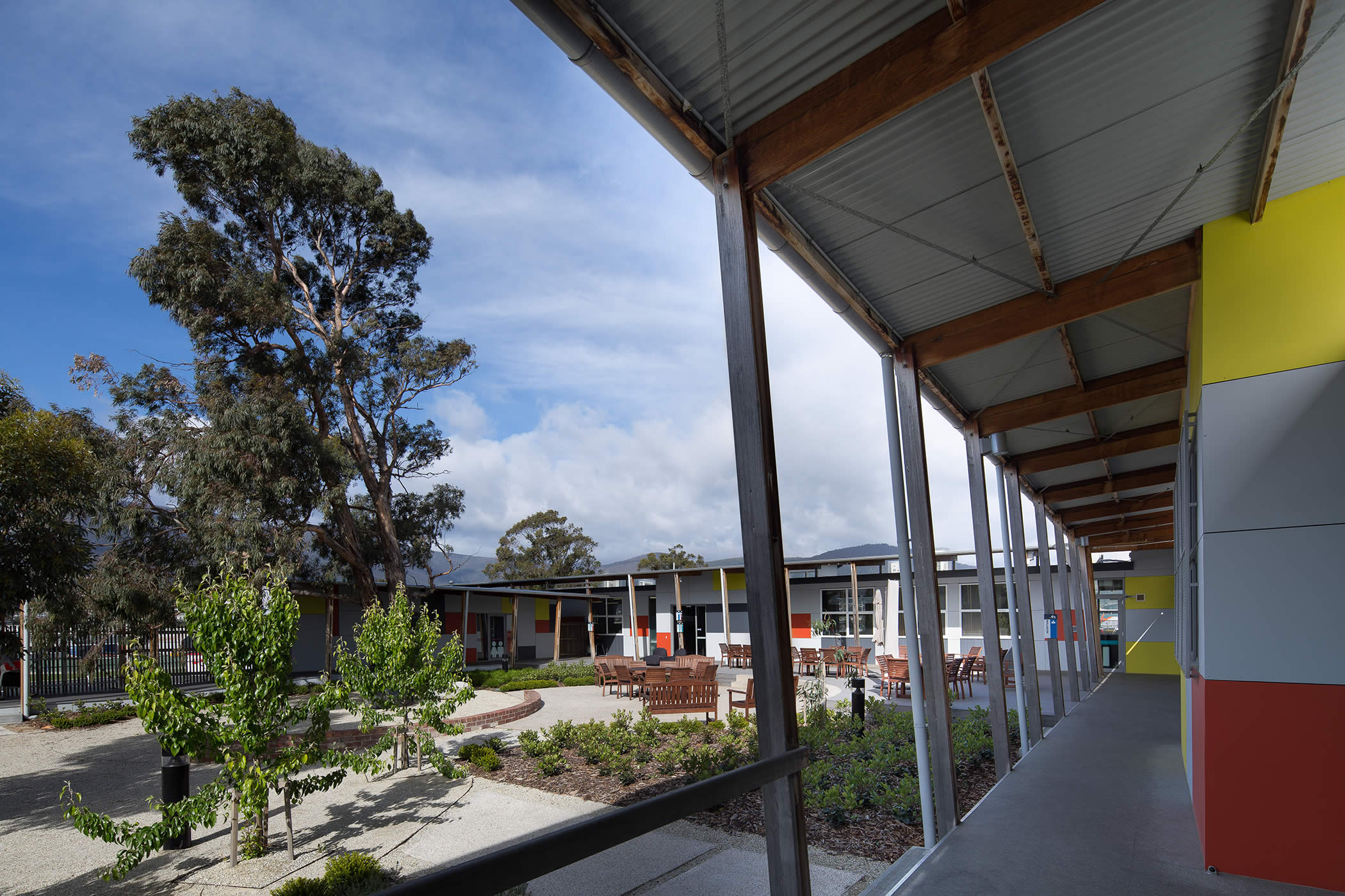 Professional Learning Institute, Goodwood, Tasmania: The learning, administration and support spaces form a sheltered external courtyard that captures sun and creates a central informal gathering space for user connection.  Photo by Thomas Ryan.