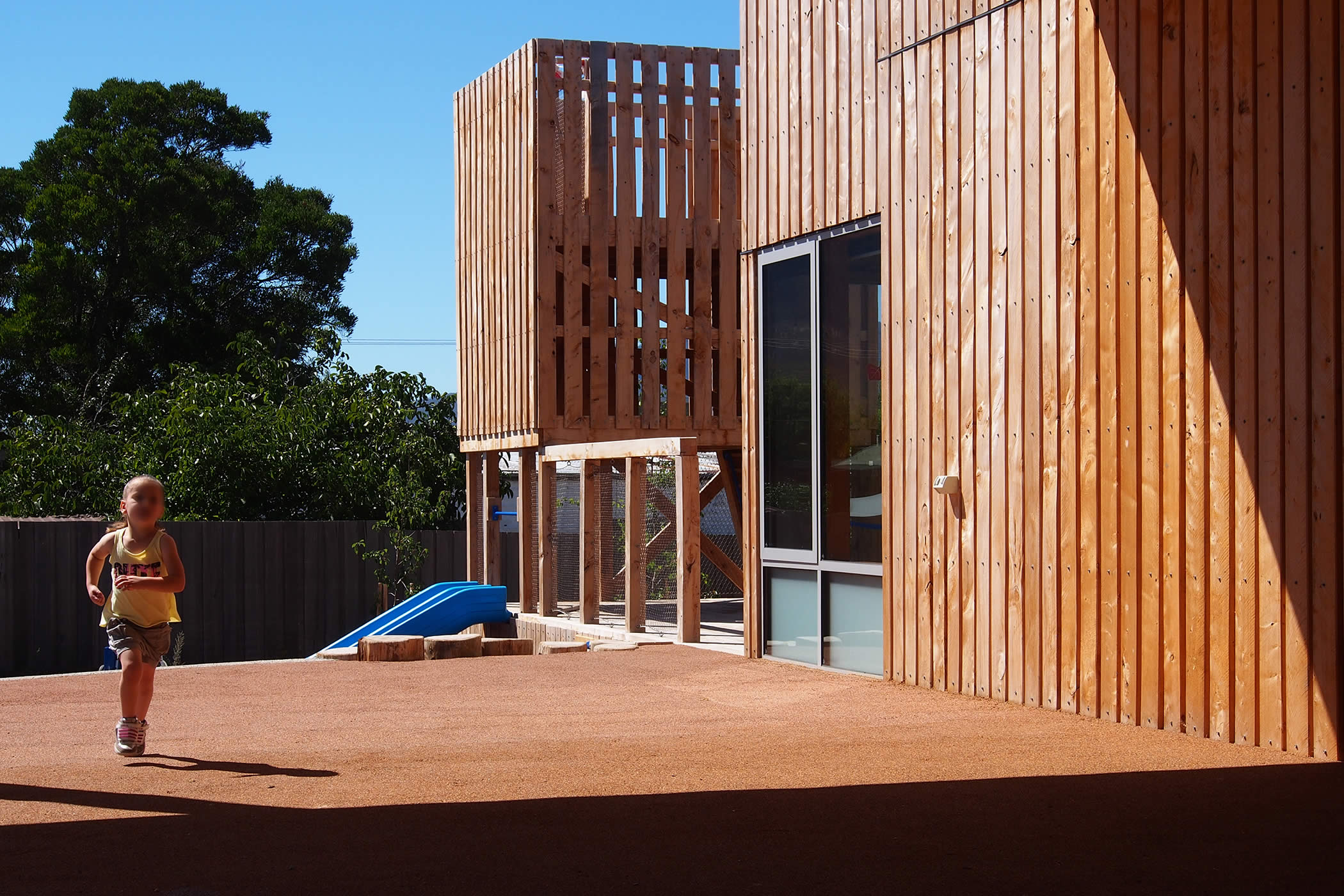 Ptunarra Child and Family Centre, New Norfolk, Tasmania: Bi-fold doors retract to bring the outside in and open the centre to generous external areas for outdoor play and garden activities and a healthy user experience.  Photo by Yvette Breytenbach.