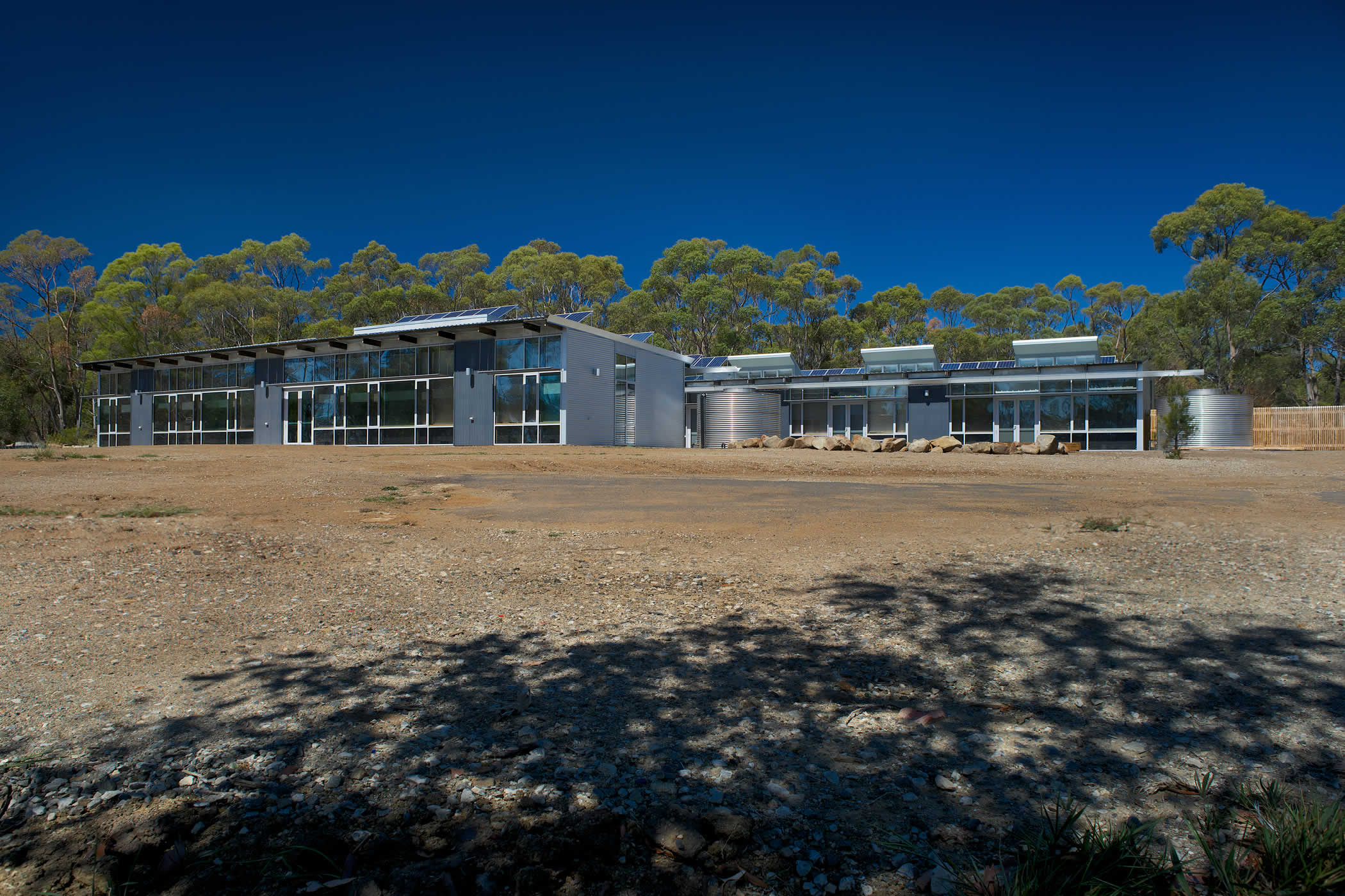 Sustainability Learning Centre, Mount Nelson, Tasmania: Trombe walls, solar walls, insulation, thermal mass, hydronic heating / cooling, and photovoltaics conserve and generate energy, and rainwater collection is expressed. Photo by Ray Joyce.