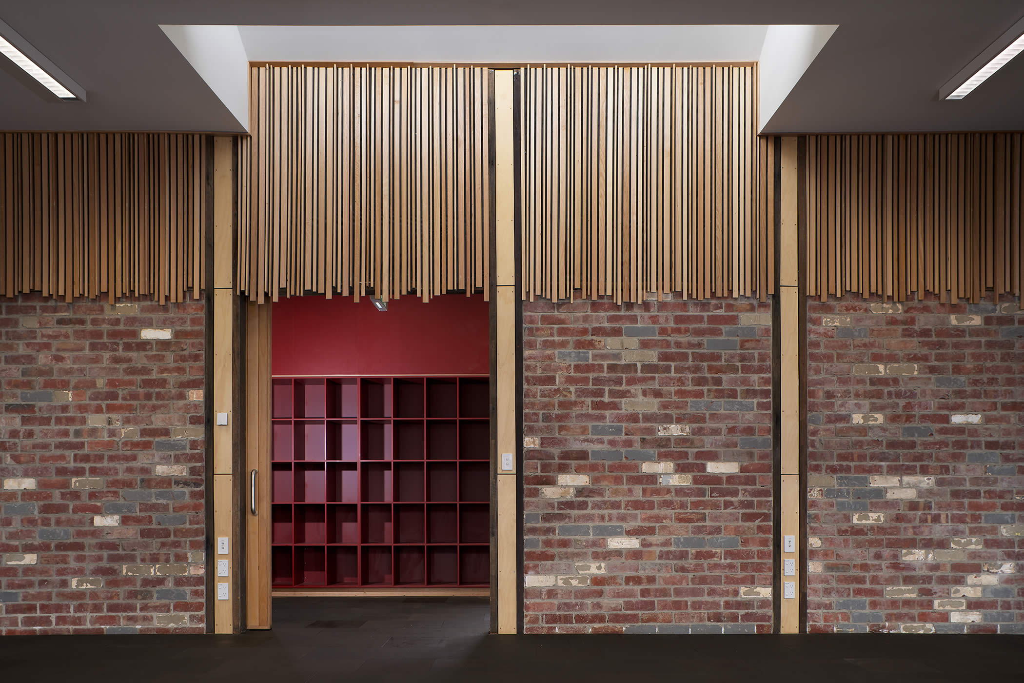 Sustainability Learning Centre, Mount Nelson, Tasmania: Decorative use of recycled timber offcuts and recycled bricks contrasts with new locker joinery. Photo by Ray Joyce.