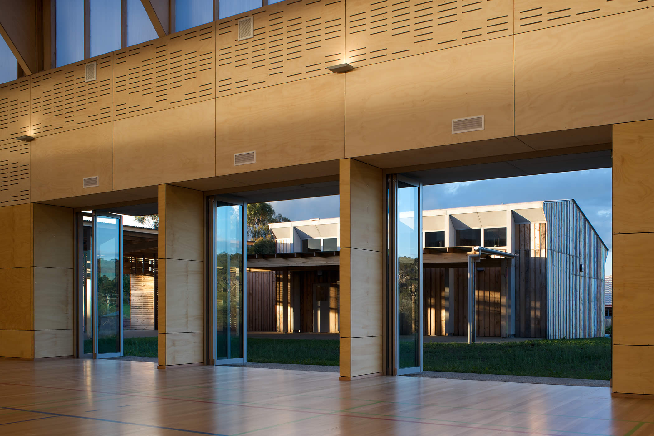 Tarremah Steiner School Hall, Huntingfield, Tasmania: The view from hall to music room shows a courtyard design of refined simplicity that is robust yet subtle, utilitarian yet profoundly moving and beautiful. Photo by Ray Joyce.