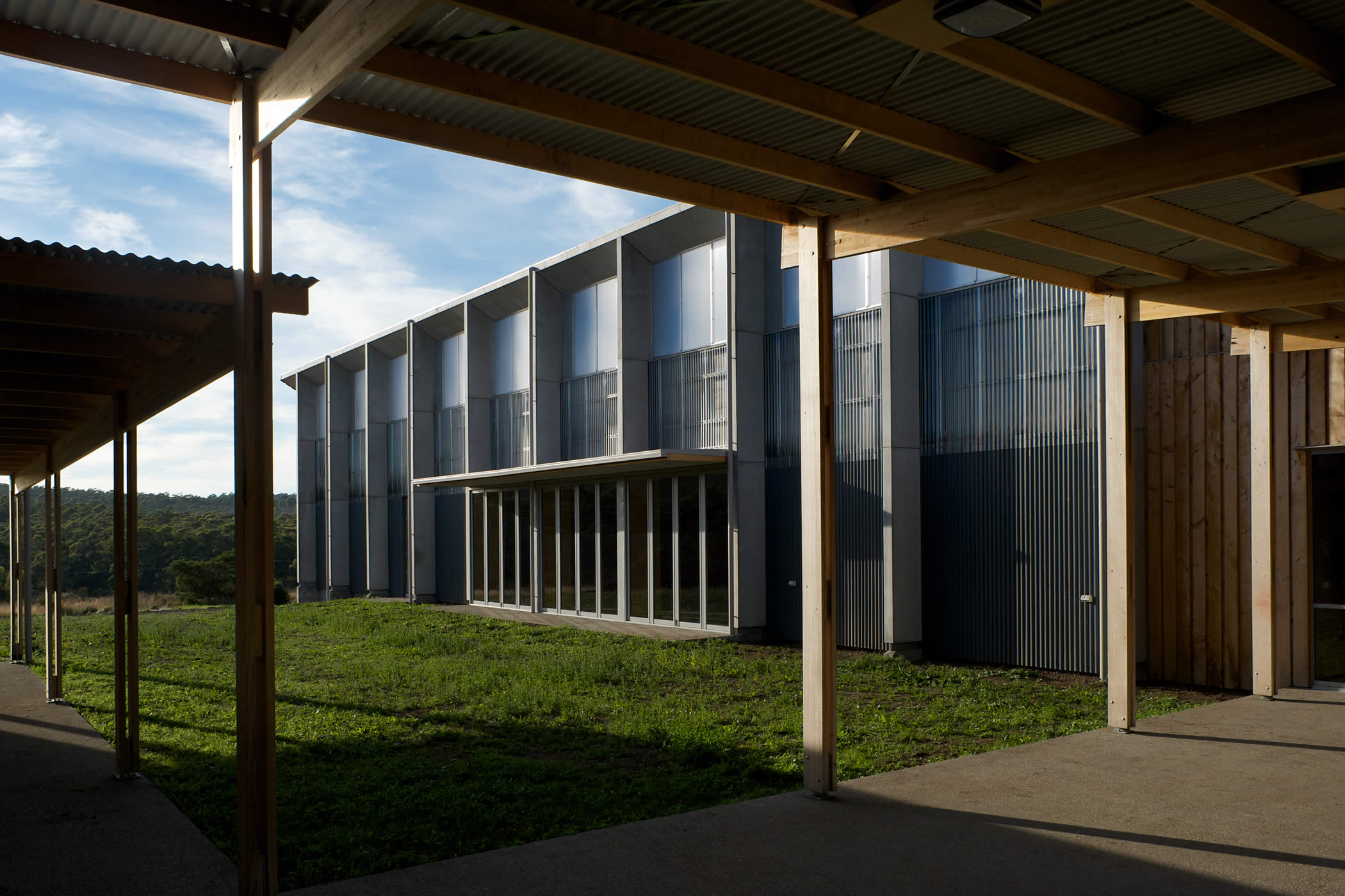 Tarremah Steiner School Hall, Huntingfield, Tasmania: The courtyard is orientated so that sunlight heats solar walls integrated into the hall’s north facade delivering energy efficient space heating. Photo by Ray Joyce.