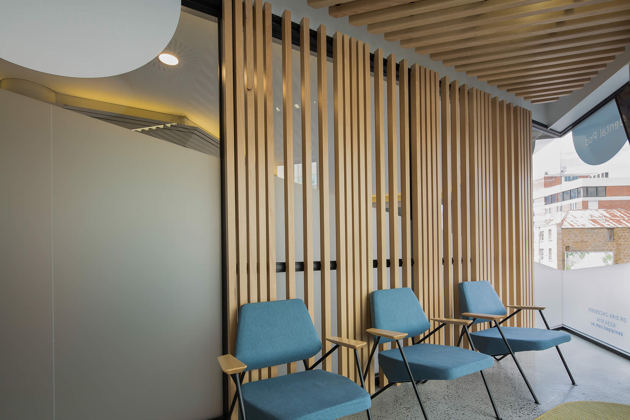 The Dental Pod interior fit-out, Hobart, Tasmania: Natural timber and contemporary elements combine with discrete views to the heritage city context to convey a distinctly Tasmanian state of the art, high quality business. Photo by Thomas Ryan.