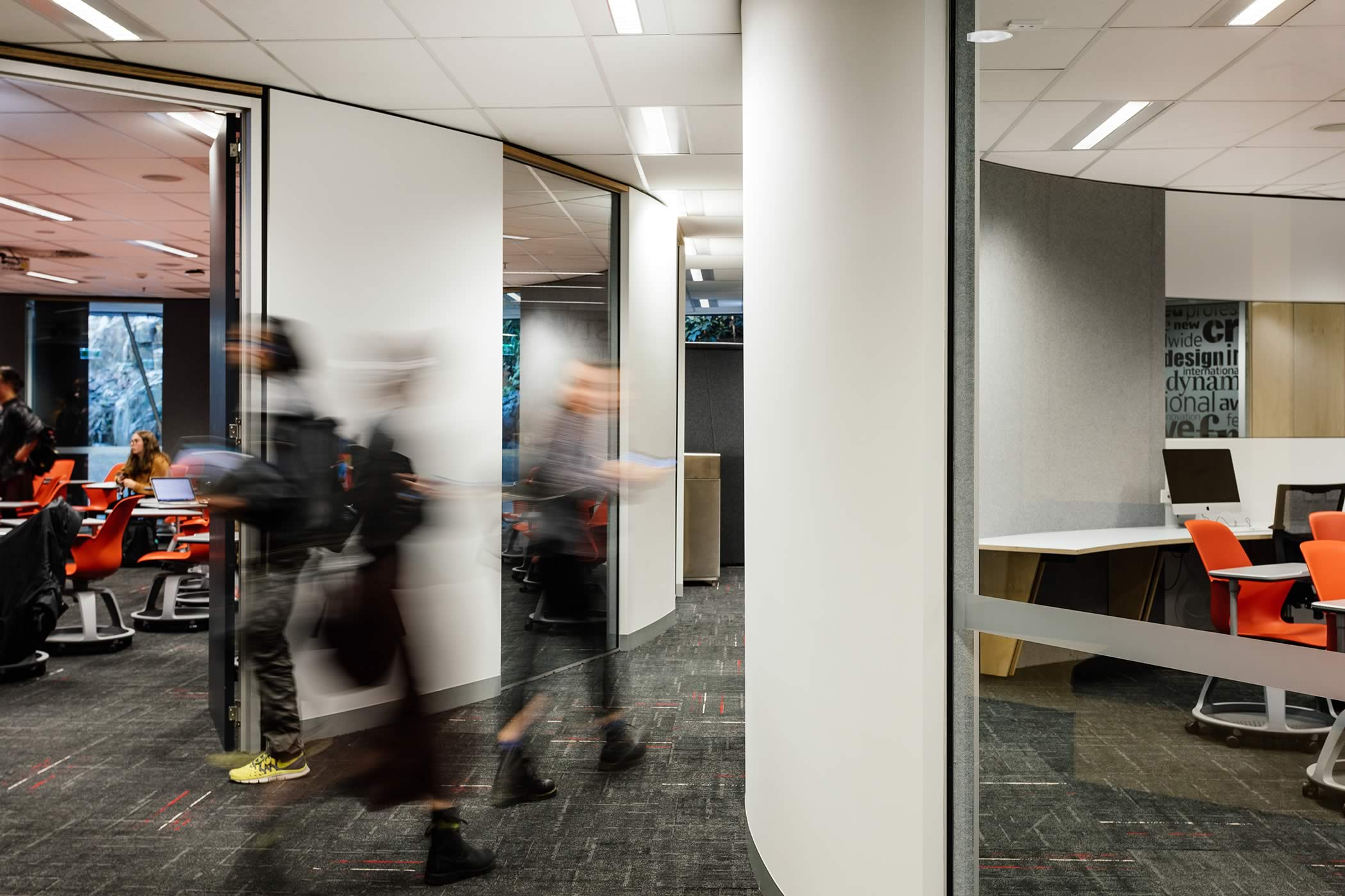 The Media School – University of Tasmania: Elliptical learning spaces open the circulation space achieving an easy flow of movement, expansive view cones and a sense of spaciousness rather than constriction. Photo by Adam Gibson.