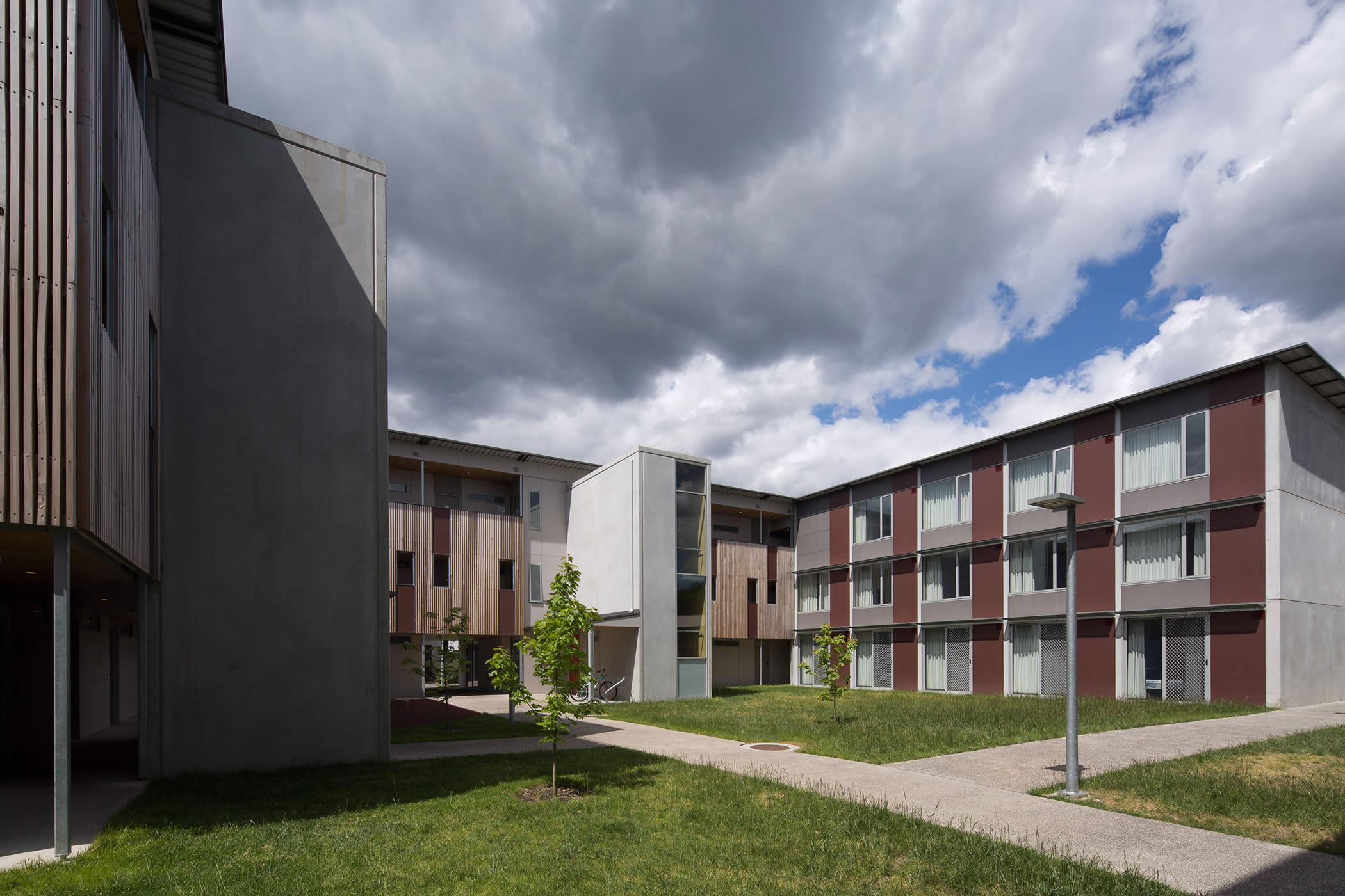 UTAS Newnham Student Residences, Tasmania: 180 self-contained NRAS apartments form a series of greened interlinking courtyards for comfortable community scale and social interaction, with pedestrian and cyclist campus access. Photo by Thomas Ryan.